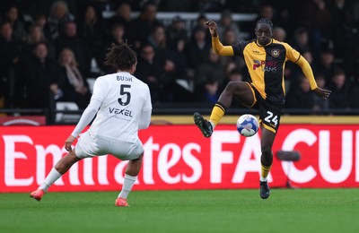 071225 - Boreham Wood v Newport County, Emirates FA Cup 2nd Round - Nathan Opoku of Newport County takes on Chris Bush of Boreham Wood