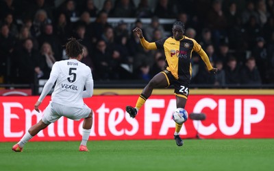 071225 - Boreham Wood v Newport County, Emirates FA Cup 2nd Round - Nathan Opoku of Newport County takes on Chris Bush of Boreham Wood