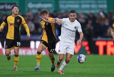 071225 - Boreham Wood v Newport County, Emirates FA Cup 2nd Round - Jeff King of Boreham Wood and Tom Davies of Newport County compete for the ball