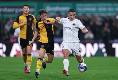 071225 - Boreham Wood v Newport County, Emirates FA Cup 2nd Round - Jeff King of Boreham Wood and Tom Davies of Newport County compete for the ball