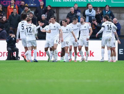 071225 - Boreham Wood v Newport County, Emirates FA Cup 2nd Round - Regan Booty of Boreham Wood celebrates with team mates after scoring the second goal