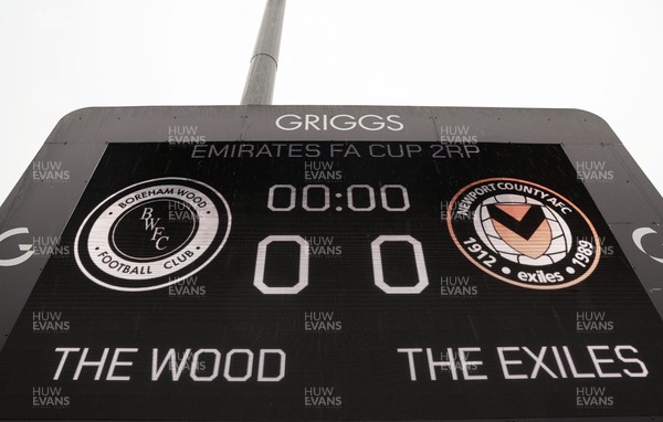 071225 - Boreham Wood v Newport County, Emirates FA Cup 2nd Round - The scoreboard ahead of the match