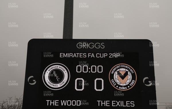 071225 - Boreham Wood v Newport County, Emirates FA Cup 2nd Round - The scoreboard ahead of the match