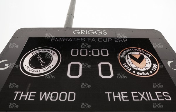 071225 - Boreham Wood v Newport County, Emirates FA Cup 2nd Round - The scoreboard ahead of the match
