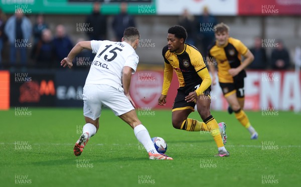 071225 - Boreham Wood v Newport County, Emirates FA Cup 2nd Round - Bobby Kamwa of Newport County takes on Jeff King of Boreham Wood