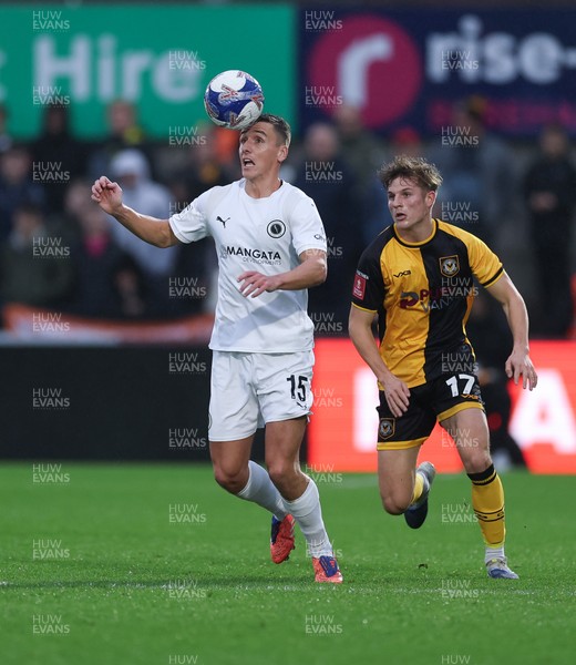 071225 - Boreham Wood v Newport County, Emirates FA Cup 2nd Round - Jeff King of Boreham Wood controls the ball as Tom Davies of Newport County closes in