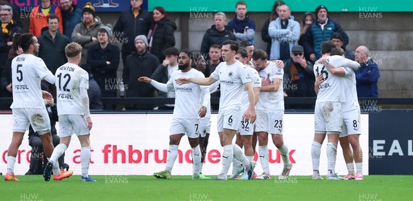 071225 - Boreham Wood v Newport County, Emirates FA Cup 2nd Round - Regan Booty of Boreham Wood celebrates with team mates after scoring the second goal