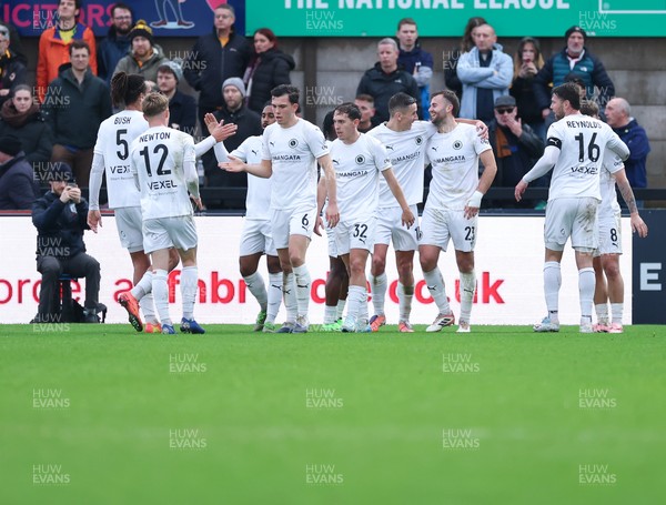 071225 - Boreham Wood v Newport County, Emirates FA Cup 2nd Round - Regan Booty of Boreham Wood celebrates with team mates after scoring the second goal
