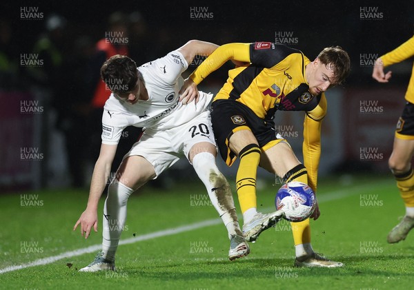071225 - Boreham Wood v Newport County, Emirates FA Cup 2nd Round - Michael Spellman of Newport County and Lewis Richardson of Boreham Wood compete for the ball