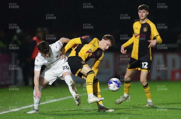 071225 - Boreham Wood v Newport County, Emirates FA Cup 2nd Round - Michael Spellman of Newport County and Lewis Richardson of Boreham Wood compete for the ball