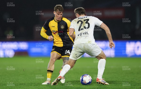 071225 - Boreham Wood v Newport County, Emirates FA Cup 2nd Round - Kai Whitmore of Newport County takes on Regan Booty of Boreham Wood