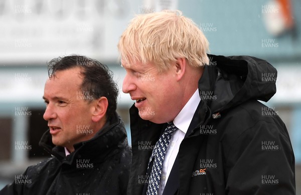 030521 -  Prime Minister Boris Johnson and Alun Cairns MP during a visit to Marco's Cafe at Barry Island, South Wales as the final week of campaigning for the Senedd elections gets under way