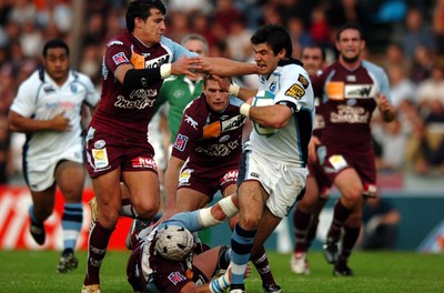 21.10.06  Bourgoin v Cardiff Blues  Mike Phillips is stopped by Irakly Giorgadze(lt) and Augusto Petrilli(on ground)  