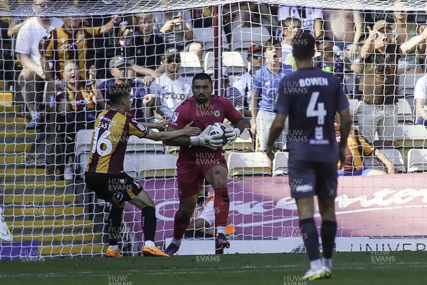 130822 - Bradford City v Newport County - Sky Bet League 2 - Nick Townsend of Newport is prevented from making a quick clearance