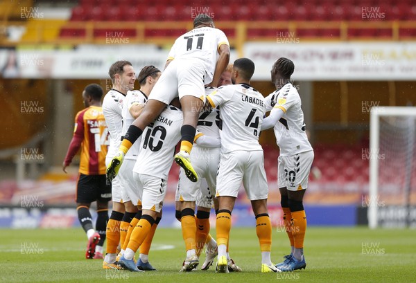 241020 - Bradford City v Newport County - Sky Bet League 2 - Mickey Demetriou of Newport County celebrates 1st goal with team and Tristan Abrahams on top