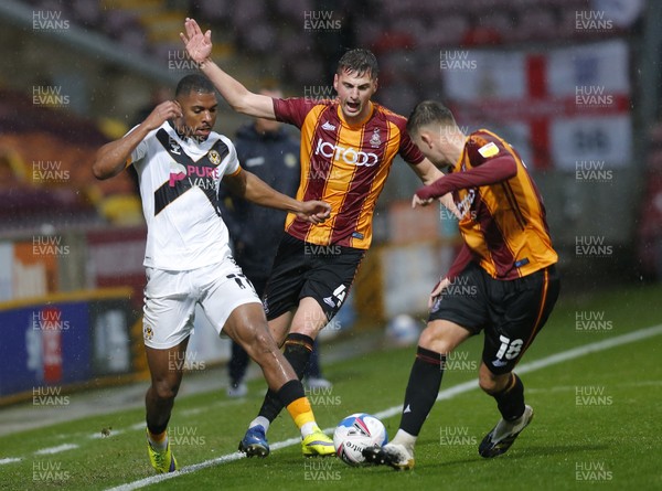 241020 - Bradford City v Newport County - Sky Bet League 2 - Tristan Abrahams of Newport County tangles with Paudie O'Connor of Bradford City and Jermaine Anderson of Bradford City