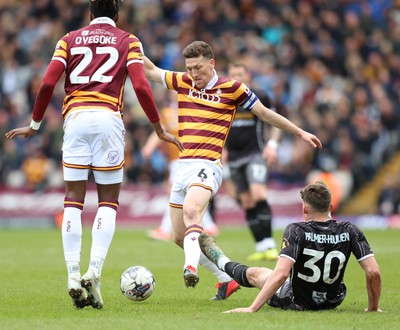 270424 - Bradford City v Newport County - Sky Bet League 2 - Seb Palmer-Houlden of Newport County loses out to Daniel Oyegoke of Bradford City and Richie Smallwood of Bradford City