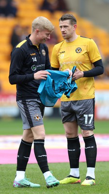 270424 - Bradford City v Newport County - Sky Bet League 2 - Scot Bennett of Newport County and Ryan Delaney of Newport County warm up before the match