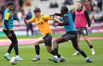 270424 - Bradford City v Newport County - Sky Bet League 2 - Seb Palmer-Houlden of Newport County and Nielson Sanca of Newport County warm up before the match