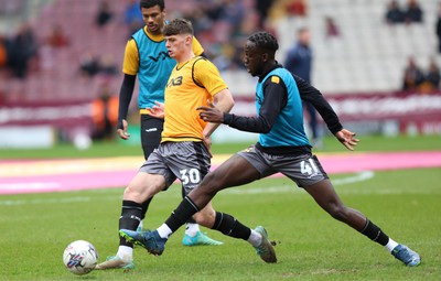 270424 - Bradford City v Newport County - Sky Bet League 2 - Seb Palmer-Houlden of Newport County and Nelson Sanca of Newport County warm up before the match