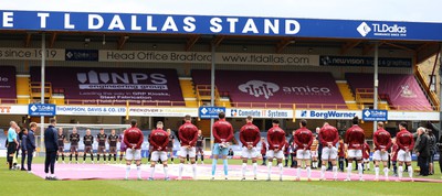 270424 - Bradford City v Newport County - Sky Bet League 2 - both teams stand for 1 min for the remembrance of the Bradford fire 39 years ago