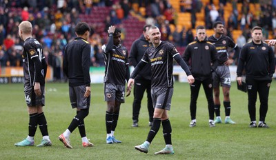 270424 - Bradford City v Newport County - Sky Bet League 2 - dejected looking side applaud the travelling fans at the end of the match