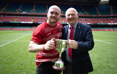 190426 - Brecon Athletic v Bargoed Athletic, Mens Division 5 Final - Captain Will Prosser of Brecon Athletic receives the trophy from WRU President Terry Cobner celebrates after winning the final