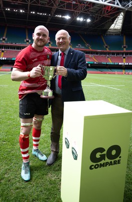 190426 - Brecon Athletic v Bargoed Athletic, Mens Division 5 Final - Captain Will Prosser of Brecon Athletic receives the trophy from WRU President Terry Cobner celebrates after winning the final