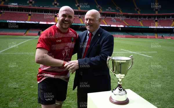 190426 - Brecon Athletic v Bargoed Athletic, Mens Division 5 Final - Captain Will Prosser of Brecon Athletic receives the trophy from WRU President Terry Cobner celebrates after winning the final