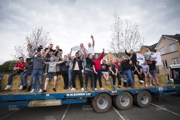 290419 - Brecon RFC Parade around the town on the back of a tractor to celebrate their victory in the WRU National Plate - Picture shows Head Coach Andy Powell with the team on the trailer