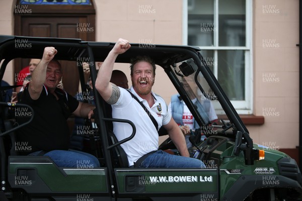 290419 - Brecon RFC Parade around the town on the back of a tractor to celebrate their victory in the WRU National Plate - Picture shows Head Coach Andy Powell in the passengers seat of the buggy leading the tractor around town