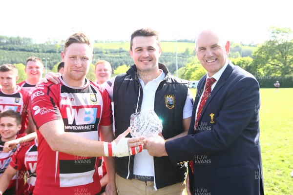 040519 - Brecon v Cwmbran -  WRU National League 1 East -  Rob Butcher of WRU presents the League trophy to match captain Eifon Jones(L) and team captain Ewan Williams of Brecon 