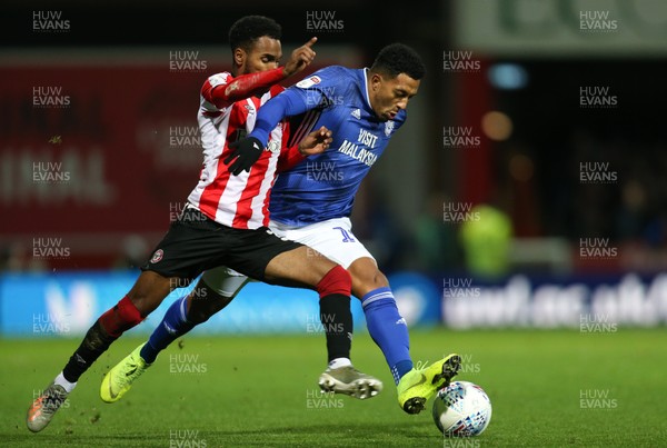 111219 - Brentford v Cardiff City, Sky Bet Championship - Nathaniel Mendez-Laing of Cardiff City and Rico Henry of Brentford compete for the ball