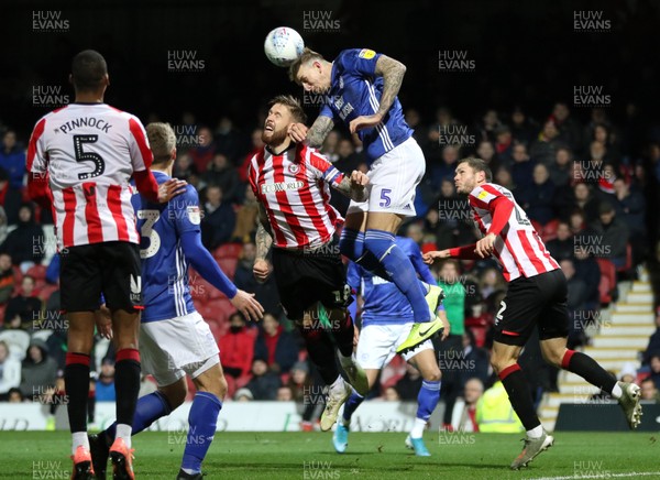 111219 - Brentford v Cardiff City, Sky Bet Championship - Aden Flint of Cardiff City wins the battle to head the ball