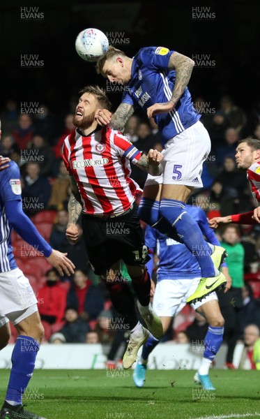 111219 - Brentford v Cardiff City, Sky Bet Championship - Aden Flint of Cardiff City wins the battle to head the ball