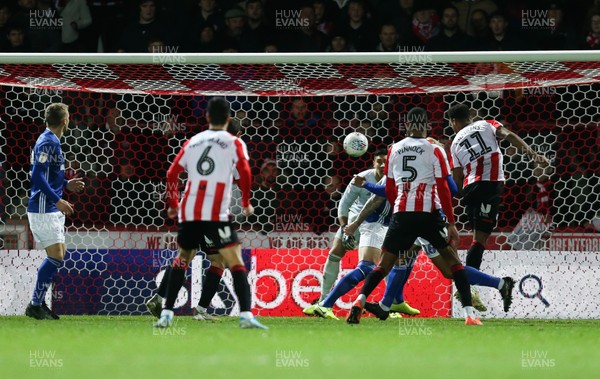 111219 - Brentford v Cardiff City, Sky Bet Championship - Ollie Watkins of Brentford, right, heads the ball to score the second goal