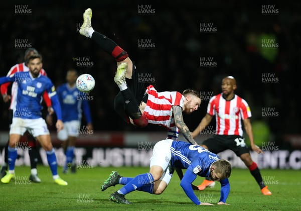 111219 - Brentford v Cardiff City, Sky Bet Championship - Danny Ward of Cardiff City collides with Pontus Jansson of Brentford as the complete for the ball
