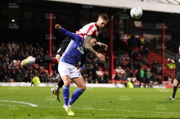 111219 - Brentford v Cardiff City, Sky Bet Championship - Pontus Jansson of Brentford puts Gary Madine of Cardiff City under pressure as he competes for the ball