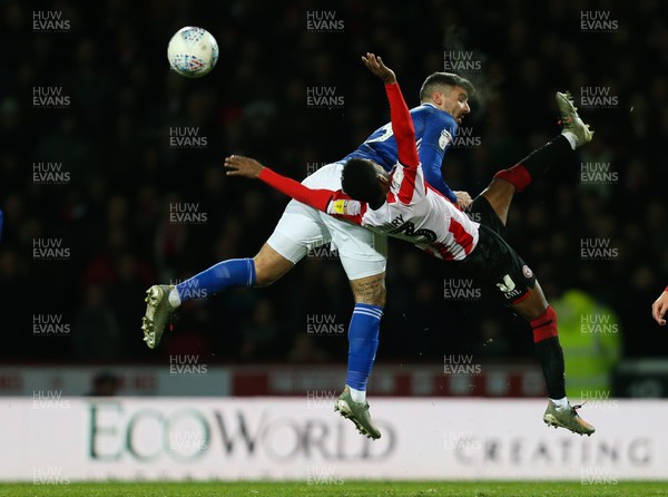 111219 - Brentford v Cardiff City, Sky Bet Championship - Callum Paterson of Cardiff City and Rico Henry of Brentford collide