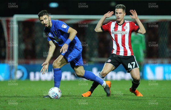 130318 - Brentford v Cardiff City, Sky Bet Championship - Marko Grujic of Cardiff City wins the ball from Sergi Canos of Brentford