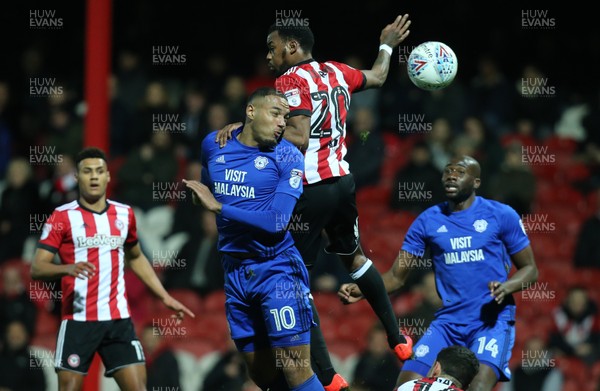 130318 - Brentford v Cardiff City, Sky Bet Championship - Kenneth Zohore of Cardiff City beats Josh Clarke of Brentford as he heads at goal