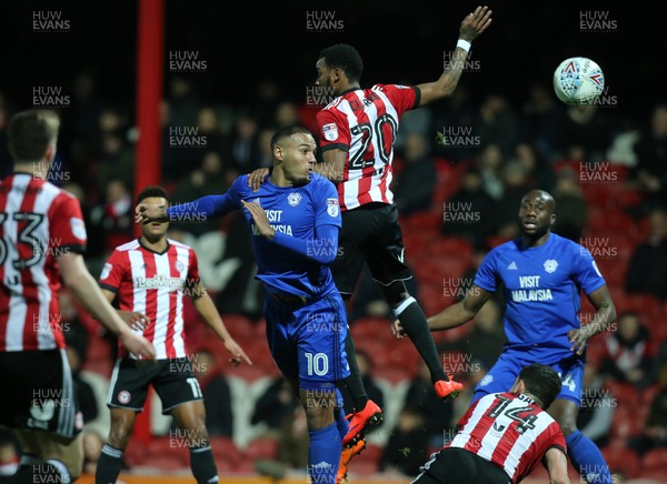 130318 - Brentford v Cardiff City, Sky Bet Championship - Kenneth Zohore of Cardiff City beats Josh Clarke of Brentford as he heads at goal