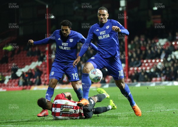 130318 - Brentford v Cardiff City, Sky Bet Championship - Kenneth Zohore of Cardiff City wins the ball from Ollie Watkins of Brentford
