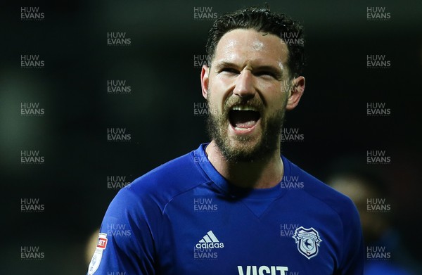 130318 - Brentford v Cardiff City, Sky Bet Championship - Sean Morrison of Cardiff City celebrates in front of the travelling fans at the end of the match