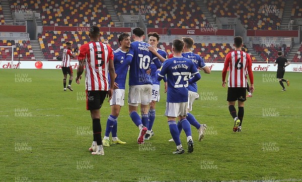 200421 Brentford v Cardiff City, Sky Bet Championship - Kieffer Moore of Cardiff City is congratulated by team  mates after he scores from the penalty spot