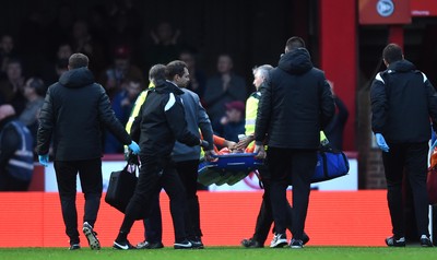 081218 - Brentford v Swansea City - SkyBet Championship - Martin Olsson of Swansea City is treated before being stretchered from the field