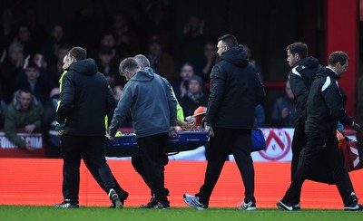 081218 - Brentford v Swansea City - SkyBet Championship - Martin Olsson of Swansea City is treated before being stretchered from the field