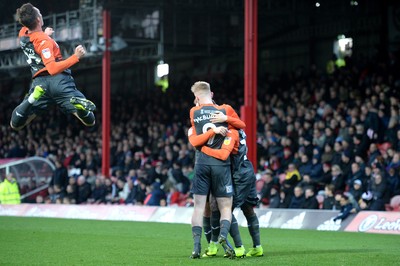 081218 - Brentford v Swansea City - SkyBet Championship - Swansea City players celebrate an own goal by Chris Mepham of Brentford