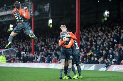 081218 - Brentford v Swansea City - SkyBet Championship - Swansea City players celebrate an own goal by Chris Mepham of Brentford