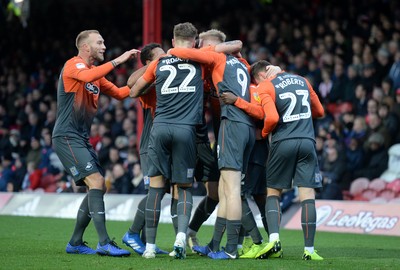 081218 - Brentford v Swansea City - SkyBet Championship - Swansea City players celebrate an own goal by Chris Mepham of Brentford